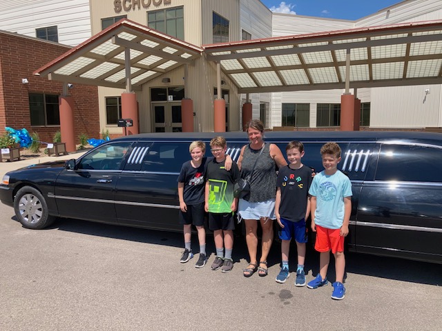 Group with limo outside school event transportation
